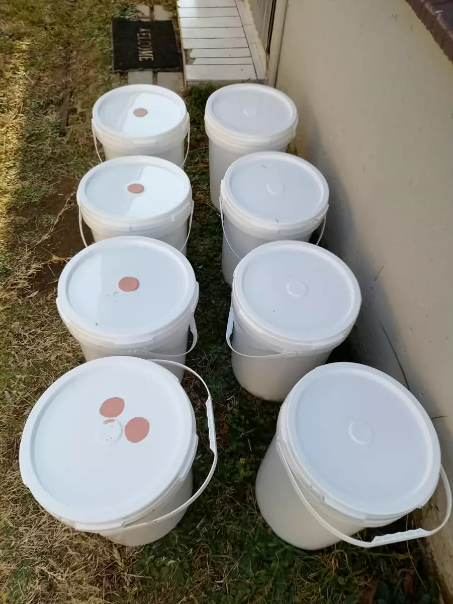 Modekai paint mixed in buckets
