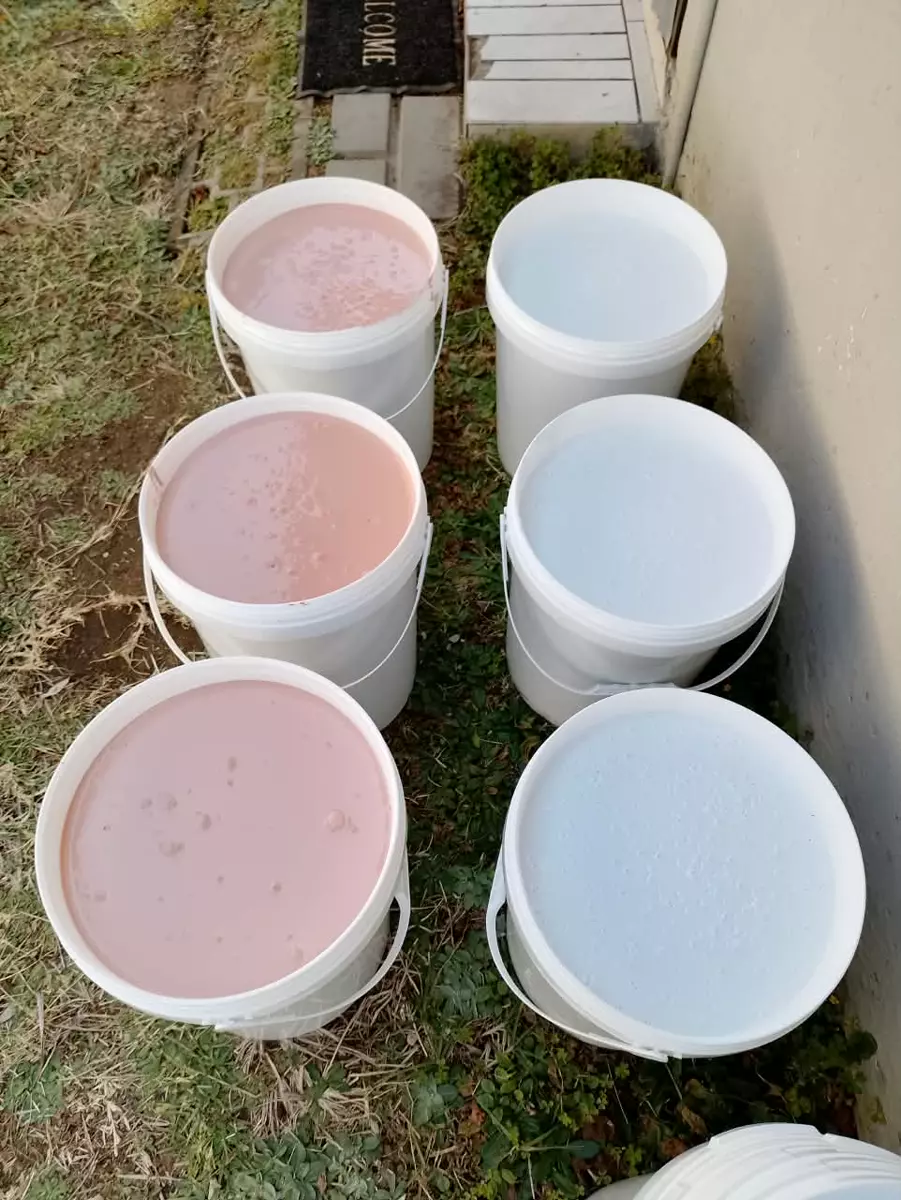 Modekai paint mixed in buckets