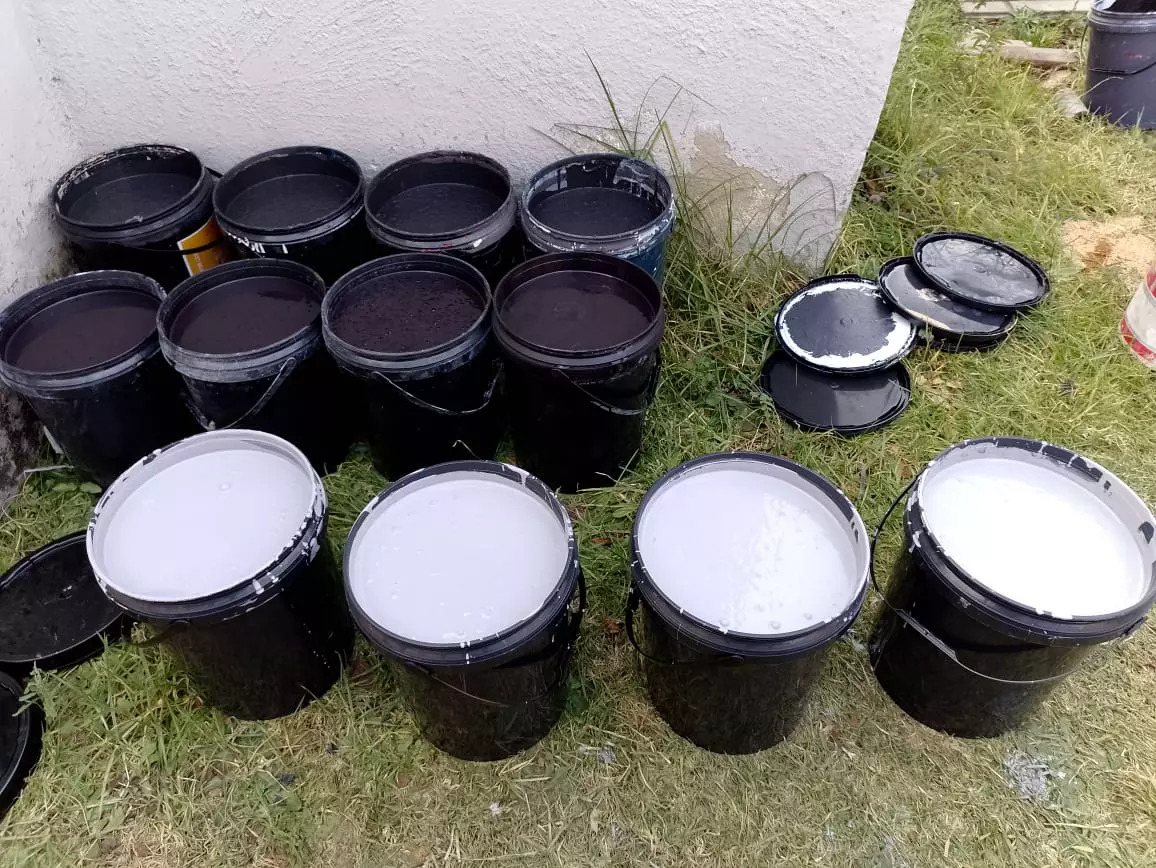Modekai paint mixed in buckets