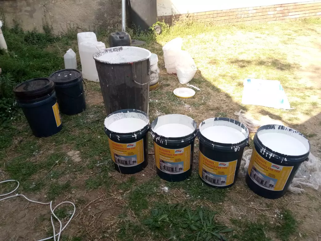 Modekai paint mixed in buckets